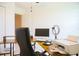 Bright office featuring a work desk and a comfortable chair at 130 Claire Ln, Davenport, FL 33837
