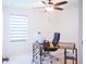 Bright office featuring a work desk and a comfortable chair facing a bright window at 130 Claire Ln, Davenport, FL 33837