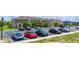 A parking lot with multiple cars parked under a bright, sunny sky at 130 Claire Ln, Davenport, FL 33837