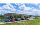 Exterior view of a parking lot with various cars parked in front of apartment buildings at 130 Claire Ln, Davenport, FL 33837