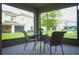 Relaxing screened patio with outdoor seating, with a nice view of the lawn at 130 Claire Ln, Davenport, FL 33837