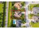Overhead view of home showcasing landscaping, nestled in a neighborhood with swimming pools and lush greenery at 1415 Ellis Fallon Loop, Oviedo, FL 32765