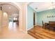 Open-concept dining area with wood floors, seamlessly connecting to the living space at 1415 Ellis Fallon Loop, Oviedo, FL 32765