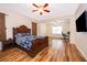 The main bedroom features wood floors, a ceiling fan, and access to a secondary sitting room at 1415 Ellis Fallon Loop, Oviedo, FL 32765