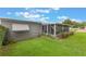 Charming home with a well-maintained lawn, screened in patio and beautiful landscaping at 142 Florence Blvd, Debary, FL 32713