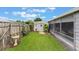 Well-kept backyard featuring a shed and serene screened-in porch, ideal for relaxation and leisure at 142 Florence Blvd, Debary, FL 32713