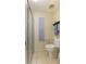 Clean and simple bathroom with shower stall, toilet and a small window at 142 Florence Blvd, Debary, FL 32713