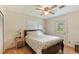 Cozy bedroom with a side table and window view to the backyard at 142 Florence Blvd, Debary, FL 32713
