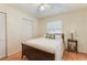 Bedroom features include a bed, a side table, a window and a closet for storage at 142 Florence Blvd, Debary, FL 32713