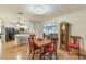 Cozy dining room adjacent to kitchen, complete with wooden dining table at 142 Florence Blvd, Debary, FL 32713