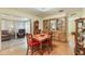 Cozy dining room adjacent to living room, complete with wooden dining table at 142 Florence Blvd, Debary, FL 32713
