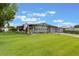 Charming single-story home with a well-manicured lawn and brick driveway at 142 Florence Blvd, Debary, FL 32713