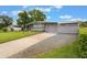 Charming single-story home with a well-manicured lawn and brick driveway at 142 Florence Blvd, Debary, FL 32713