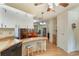 Eat-in kitchen with wood countertops and bar stool seating overlooks the adjacent dining and living areas at 142 Florence Blvd, Debary, FL 32713