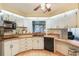 Classic kitchen featuring white cabinets and an undermount sink and wood countertop at 142 Florence Blvd, Debary, FL 32713