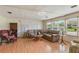 Bright and spacious living room with hardwood floors and comfortable seating at 142 Florence Blvd, Debary, FL 32713