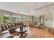 Bright and spacious living room with large windows and hardwood floors at 142 Florence Blvd, Debary, FL 32713