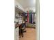 Spacious walk-in closet featuring clothing racks and a vanity desk with storage at 142 Florence Blvd, Debary, FL 32713