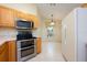 Well-equipped kitchen with stainless steel appliances, a bright eat-in area, and ample cabinet space for storage at 14224 Colonial Lakes Dr, Orlando, FL 32826