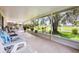 Screened-in lanai featuring ample seating and outdoor space with views of the backyard at 14224 Colonial Lakes Dr, Orlando, FL 32826