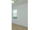 Neutral bedroom with tile flooring and a window with blinds at 147 Seville Dr, Davenport, FL 33837