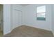 Neutral bedroom with carpet, a closet, and a window with blinds at 147 Seville Dr, Davenport, FL 33837