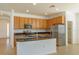 Well-lit kitchen with stainless steel appliances and granite countertops at 147 Seville Dr, Davenport, FL 33837