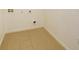 Compact laundry room with tile flooring and utility connections, ready for washer and dryer at 147 Seville Dr, Davenport, FL 33837
