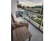 Balcony offers a cozy seating area with wicker furniture and views of the surrounding cityscape at 150 E Robinson St # 419, Orlando, FL 32801