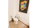Bathroom featuring a toilet and colorful wall art at 150 E Robinson St # 419, Orlando, FL 32801