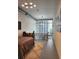 Spacious bedroom with large windows offering city views and adjacent to a lofted area at 150 E Robinson St # 419, Orlando, FL 32801