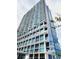 A sleek modern building with floor-to-ceiling glass and private balconies provides stunning views at 150 E Robinson St # 419, Orlando, FL 32801