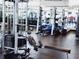 Well-equipped gym featuring weight machines, free weights, and mirrors for a comprehensive workout space at 150 E Robinson St # 419, Orlando, FL 32801