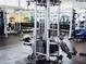 Modern gym with weight machines and equipment for a complete workout, with abundant natural light at 150 E Robinson St # 419, Orlando, FL 32801