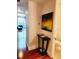 Hallway leading to living area with hardwood floors, and a view of the bathroom at 150 E Robinson St # 419, Orlando, FL 32801