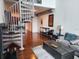 Spacious living room with hardwood floors, spiral staircase, and comfortable seating at 150 E Robinson St # 419, Orlando, FL 32801