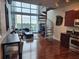 Bright living room features a spiral staircase, hardwood floors, and modern kitchen at 150 E Robinson St # 419, Orlando, FL 32801