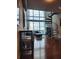 Modern living room featuring hardwood floors, large windows with a view, and spiral staircase at 150 E Robinson St # 419, Orlando, FL 32801