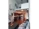 Bright living room with hardwood floors, spiral staircase, and a view of the modern kitchen at 150 E Robinson St # 419, Orlando, FL 32801