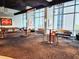 Spacious lounge with tall windows, lounge seating, and pool table at 150 E Robinson St # 419, Orlando, FL 32801