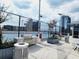 Outdoor kitchen area with grills overlooking city skyline at 150 E Robinson St # 419, Orlando, FL 32801