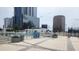 Relaxing rooftop pool area with lounge chairs and city views at 150 E Robinson St # 419, Orlando, FL 32801