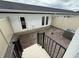 Private backyard patio with a neutral fence, offering an ideal outdoor living space at 15316 Burgtheater Dr, Winter Garden, FL 34787