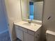 Well-lit bathroom with a vanity featuring a white countertop and fixtures, offering a clean and modern space at 15316 Burgtheater Dr, Winter Garden, FL 34787