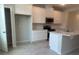 Bright kitchen featuring white cabinets, stainless steel appliances, a large island with sink, and open pantry at 15316 Burgtheater Dr, Winter Garden, FL 34787
