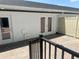 Back patio features a brick floor, access doors and a black metal railing at 15316 Burgtheater Dr, Winter Garden, FL 34787