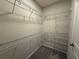 Spacious walk-in closet with multiple levels of wire shelving for optimal organization at 15316 Burgtheater Dr, Winter Garden, FL 34787