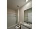 Bathroom with a shower-tub combo and granite vanity top at 1727 Buckeye Rd, Davenport, FL 33837