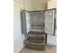 Stainless steel refrigerator with French door and pull out freezer drawers at 1727 Buckeye Rd, Davenport, FL 33837