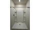 Modern walk-in shower with built-in shelves and sleek fixtures at 1727 Buckeye Rd, Davenport, FL 33837